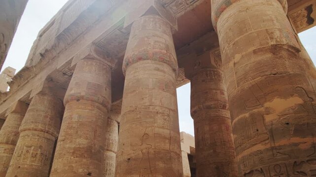 Closed papyrus umbel capitals and architrave on the central columns of the Hypostyle Hall. The Karnak Temple Complex, Luxor, Upper Egypt. UNESCO World Heritage Site