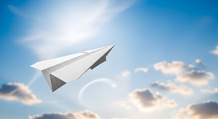 Fototapeta premium A white paper airplane soaring through a bright blue sky with fluffy white clouds and sunshine