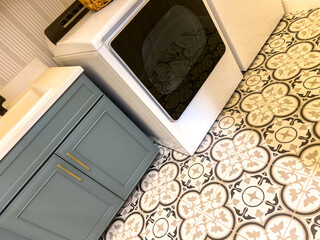 Laundry room with washer, sink, and tile floor