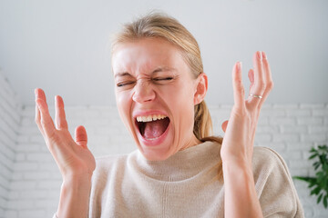upset woman standing indoors at home looking, facial expression worry about trouble or problem