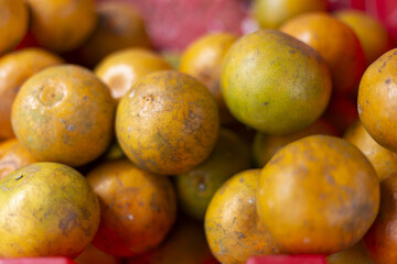 Vibrant, fresh pile of ripe oranges, displaying natural orange and green hues. Healthy citrus fruits evoke feelings of refreshment and natural goodness, ready for consumption