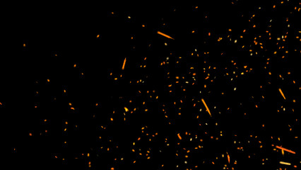 Blurred fire embers sparks on black background . Texture isolated overlays. Concept of particles, sparkles, light and flame. © Victor