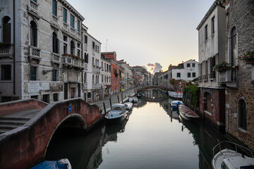 Characteristic canal with historic buildings in Venice, Italy.