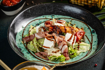 Mediterranean salad with prosciutto, cheese and balsamic glaze