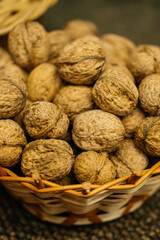A rustic, charming basket brimming with whole walnuts, beautifully showcasing their rough textures and natural beauty