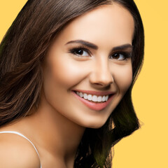 Studio portrait image of young happy smiling cute brunette hair cheerful woman wear white casual clothing, isolated yellow color background. Square.