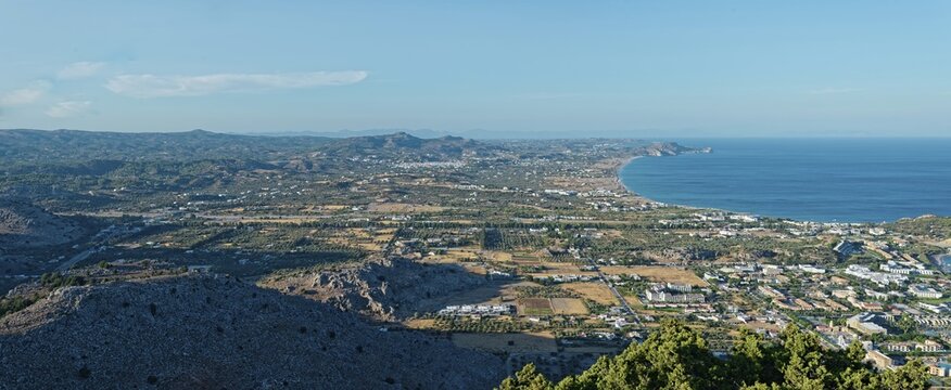 Expansive coastal landscape of Kolymbia and Faliraki, with mountain ranges and coastline under a clear blue sky, Church of the Virgin Mary Tsambika (Kyra Psili), Archangelos, Rhodes Island, Greece