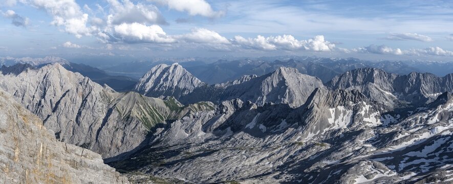View of the Zugspitzplatt and mountain peaks of the Mieminger Kette with Hohe Munde and Hochwand, view from the summit of the Zugspitze, Wetterstein range, Bavaria, Germany
