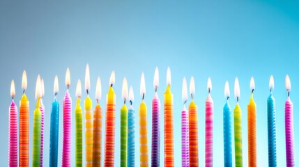Colorful Birthday Candles of Varied Height Flickering on a Gradient Blue Background