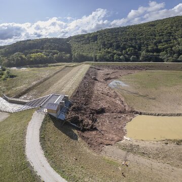 Blockages caused by wood at the Fahrafeld flood defence after a severe storm, Pottenstein, Lower Austria, Austria