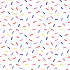 Fun seamless minimal white pattern with bright scattered sprinkles festive decoration for birthday cards, textile and modern designs
