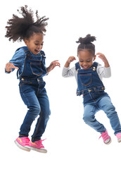 two young black girls playing and dancing, wearing denim overalls and pink shoes, against isolated on a transparent background.