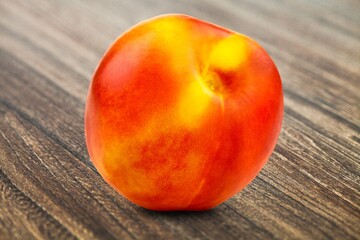 Pink fresh ripe peach fruit on the desk