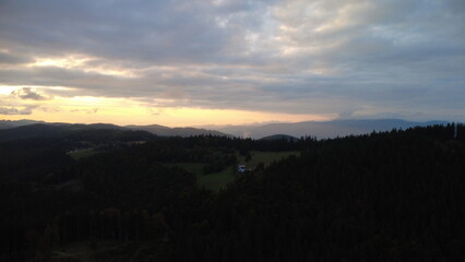Amazing view of the mountains in the evening light, scenic landscape with glowing horizon and peaceful atmosphere