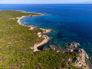 Aerial view of the beautiful beach of Vignola Mare with its tower