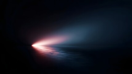 An abstract beam of light illuminates a dark reflective surface with pink and blue hues