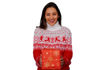 Happy woman holding christmas gift, expressing surprise and joy during holiday celebration, transparent background