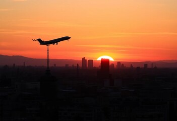 Sunset silhouettes plane over Madrid skyscrapers, buildings, architecture