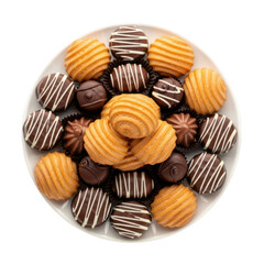 Assortment of delicious chocolate cookies and pastries on a white plate top view