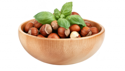 A wooden bowl filled with fresh hazelnuts and topped with green basil leaves. set against a clean white background. ideal for culinary articles or healthy eating concepts