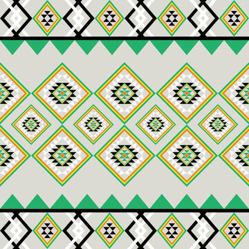 Traditional seamless geometric diamond pattern in tribal ethnic style with green, yellow, black, and white colors. Perfect for fabric, textile, wallpaper, wrapping paper, and digital background design