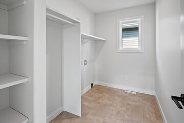 Small, empty room with a window and a door