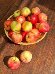 Basket of Apples on Wooden Table