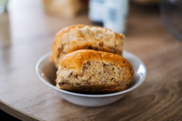 Freshly baked rolls sit in a bowl, ready to be enjoyed. A simple pleasure.