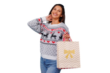 Happy young woman in festive sweater celebrating winter holidays, holding shopping bag, finding discounts, transparent background