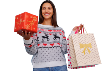 Woman holding christmas gift and shopping bags, celebrating holidays, seasonal shopping, transparent background