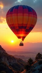 A vibrant hot air balloon floats gracefully against a breathtaking sunrise, casting a warm glow on the landscape below  Perfect for travel, adventure, and freedom themes ,  basket,  upward