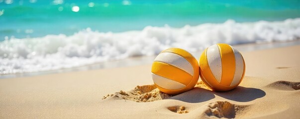 Obraz premium Two beach volleyballs sit in the warm sand near a gently lapping ocean wave, ready for a game under the bright sun Perfect summer vacation imagery , sun, teamwork
