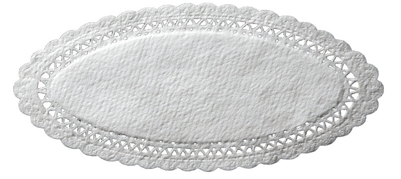 A delicately textured oval doily with intricate lace edging, offering a touch of timeless elegance and nostalgic charm. It&rsquo;s a versatile image that could be a design element.