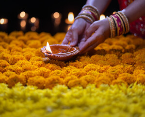 Clay diya lamps lit during diwali celebration, Diwali, or Deepavali, is India's biggest and most important holiday.