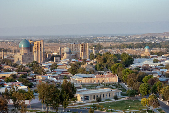 Aerial view of the Bibi Khanym Mosque and other historical structures, where ancient architecture meets modern development, Samarqand, Samarqand viloyati, Uzbekistan.