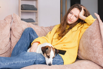Sad depressed young adult woman crying alone at home, upset