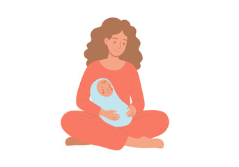 A woman with curly brown hair sits crosslegged holding a baby wrapped in a blue blanket