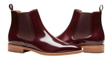 Pair of burgundy leather Chelsea boots isolated on transparent background, stylish footwear for men and women fashion