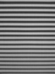 Obraz premium Corrugated Metal Wall Texture with Dynamic Shadows and Highlights