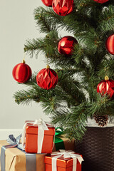 Wrapped Christmas presents under a decorated tree.