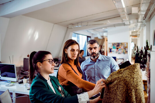 Fashion consultation in creative workspace