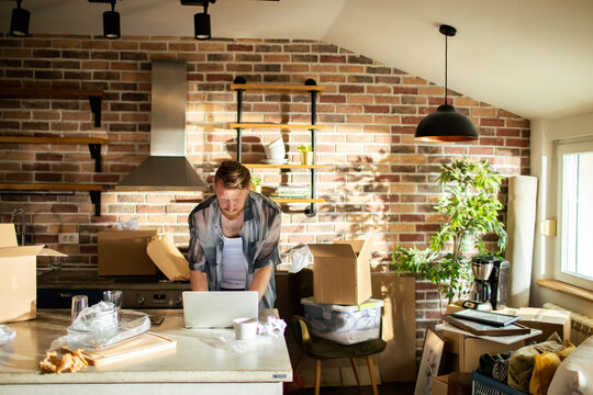 Man working in a messy kitchen
