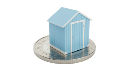 Miniature blue beach hut isolated on a one pound coin, conceptual property investment and affordable housing PNG
