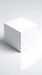 Fototapeta premium Blank white cube on a reflective surface