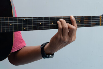 Hands playing guitar