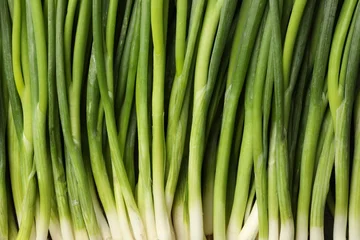 Fototapete Zu Essen Fresh green spring onions as background, top view  © New Africa