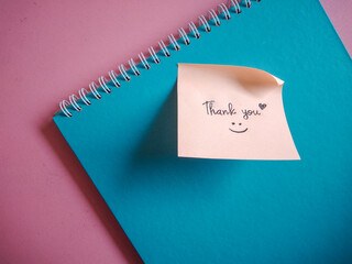 Thank You note on a Notebook. Motivational and Inspirational words for personal development. 