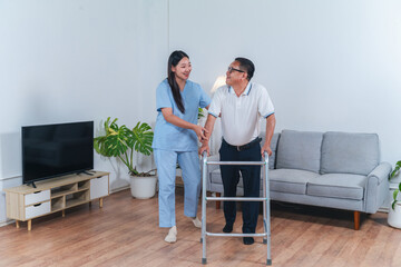 Healthcare professional assisting senior man with walker in bright living room setting, promoting independence and mobility for elderly people