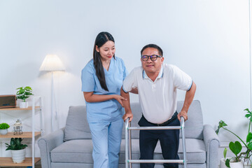 Caring healthcare professional assisting elderly man with mobility support in bright living room, promoting health, wellness, and compassionate care
