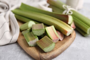 Fresh rhubarb stalks on light table, closeup